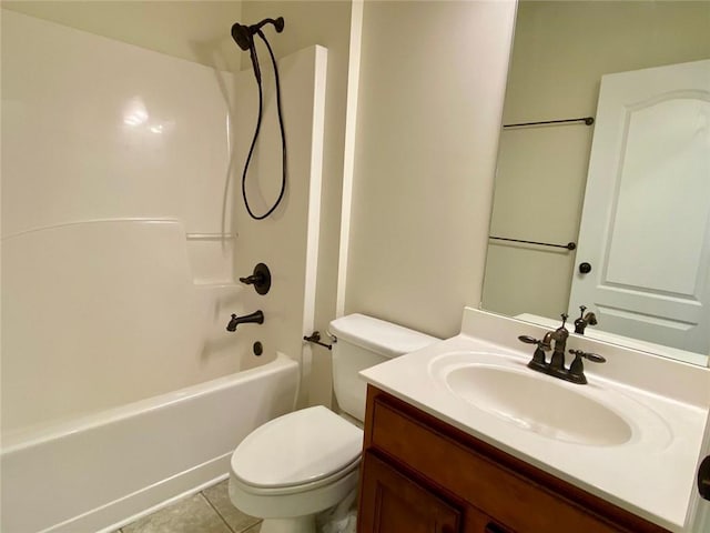 full bathroom featuring tile patterned floors, bathing tub / shower combination, toilet, and vanity