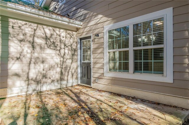 doorway to property with a patio area