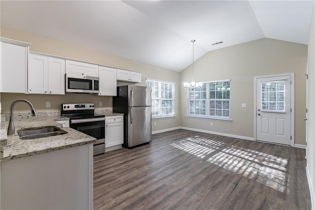 kitchen with white cabinets, appliances with stainless steel finishes, and sink