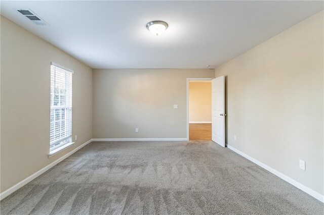 unfurnished room featuring carpet floors