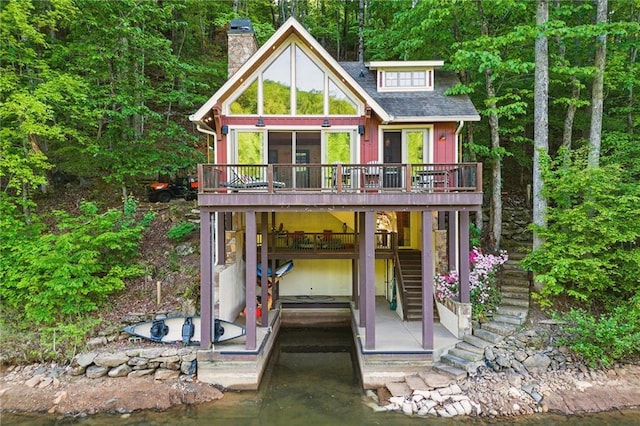 147 Lake Watch Pt, Cleveland, GA 30528 - view of front facade with stairway, a chimney, a deck with water view, and a dock