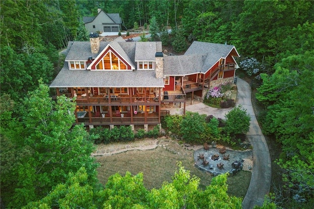 147 Lake Watch Pt, Cleveland, GA 30528 - back of house with a chimney, a wooded view, roof with shingles, and a deck