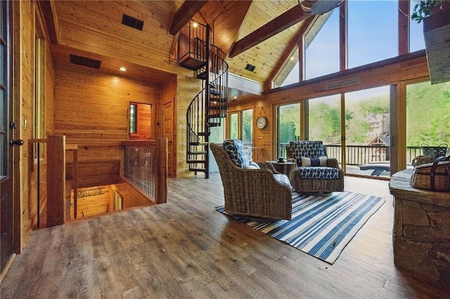 147 Lake Watch Pt, Cleveland, GA 30528 - living room featuring high vaulted ceiling, wooden walls, wood finished floors, beam ceiling, and stairs