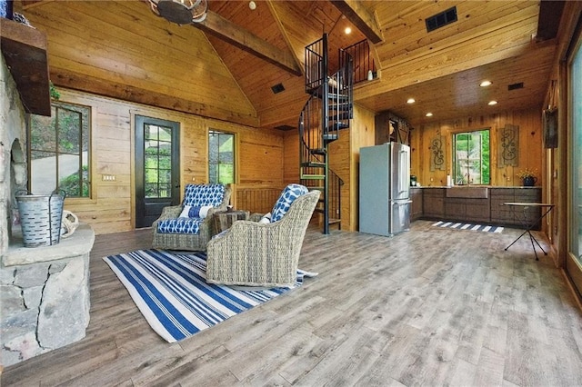 147 Lake Watch Pt, Cleveland, GA 30528 - living area with plenty of natural light, wood walls, light wood-style floors, wooden ceiling, and beam ceiling