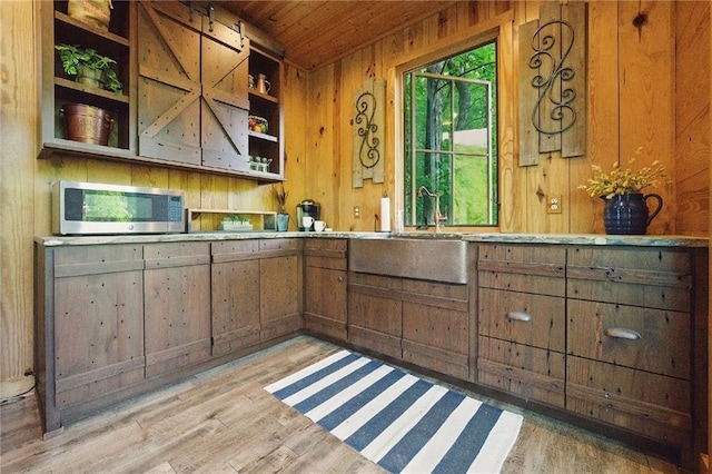 147 Lake Watch Pt, Cleveland, GA 30528 - bar area featuring stainless steel microwave, wood walls, wooden ceiling, light wood finished floors, and a sink