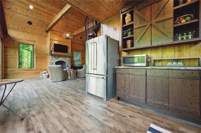 147 Lake Watch Pt, Cleveland, GA 30528 - kitchen with appliances with stainless steel finishes, open shelves, wood ceiling, wooden walls, and a fireplace