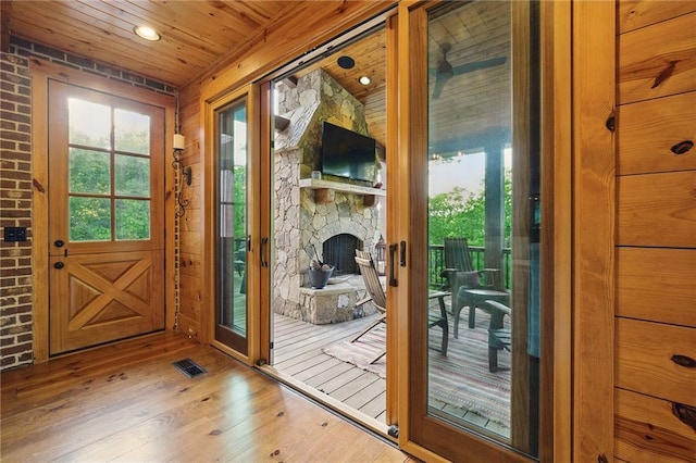 147 Lake Watch Pt, Cleveland, GA 30528 - doorway to outside featuring wood-type flooring, wood ceiling, a stone fireplace, and recessed lighting