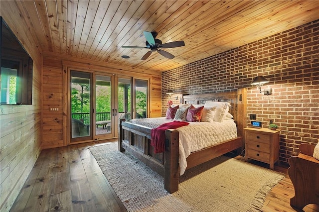 147 Lake Watch Pt, Cleveland, GA 30528 - bedroom with multiple windows, wood ceiling, wood-type flooring, access to outside, and brick wall