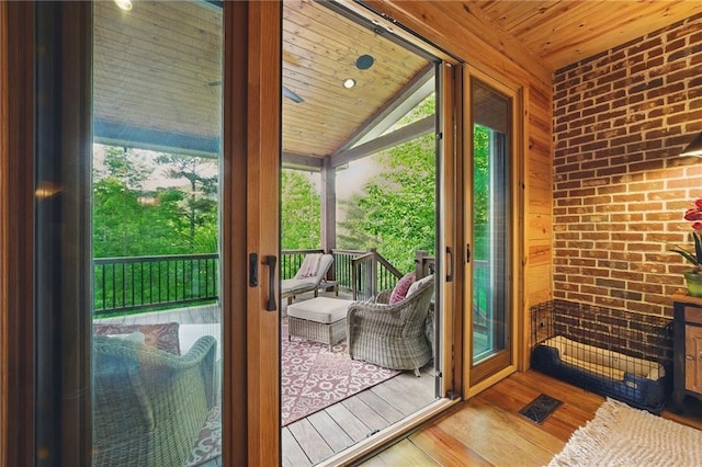147 Lake Watch Pt, Cleveland, GA 30528 - doorway to outside with wood-type flooring, wooden ceiling, lofted ceiling, and brick wall