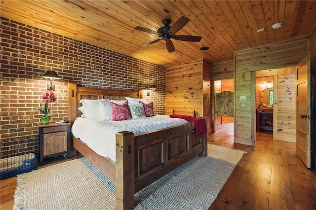 147 Lake Watch Pt, Cleveland, GA 30528 - bedroom featuring wood ceiling, wood-type flooring, brick wall, wood walls, and ceiling fan