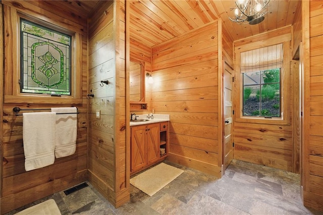 147 Lake Watch Pt, Cleveland, GA 30528 - bathroom featuring wood ceiling, wooden walls, stone finish flooring, healthy amount of natural light, and a chandelier