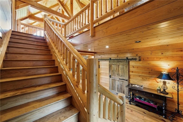 147 Lake Watch Pt, Cleveland, GA 30528 - stairway featuring wood walls, a barn door, wood finished floors, and recessed lighting