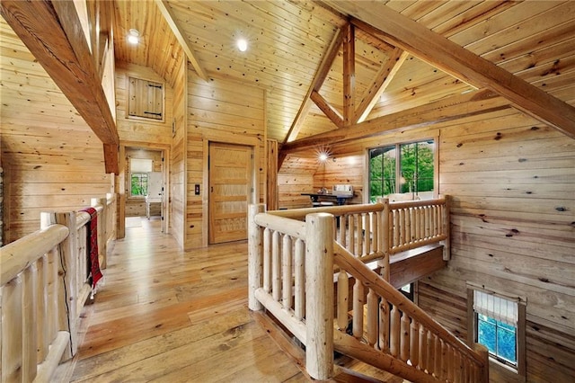 147 Lake Watch Pt, Cleveland, GA 30528 - hallway featuring an upstairs landing, wood walls, beam ceiling, wooden ceiling, and light wood-style floors