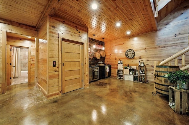 147 Lake Watch Pt, Cleveland, GA 30528 - living area featuring wood walls, concrete floors, recessed lighting, wooden ceiling, and wine cooler