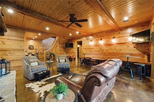 147 Lake Watch Pt, Cleveland, GA 30528 - living area with finished concrete floors, beam ceiling, wooden walls, stairway, and ceiling fan