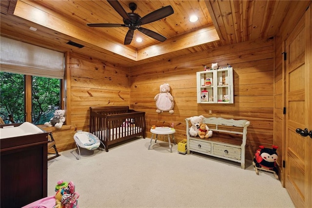 147 Lake Watch Pt, Cleveland, GA 30528 - carpeted bedroom featuring wood ceiling, a crib, wood walls, recessed lighting, and a tray ceiling