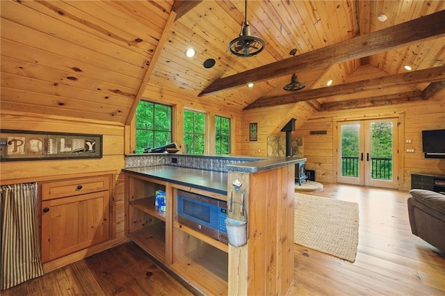 147 Lake Watch Pt, Cleveland, GA 30528 - kitchen featuring open floor plan, wood walls, healthy amount of natural light, wooden ceiling, and french doors
