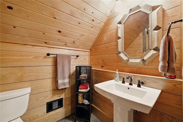 147 Lake Watch Pt, Cleveland, GA 30528 - bathroom with wooden walls, toilet, and vaulted ceiling