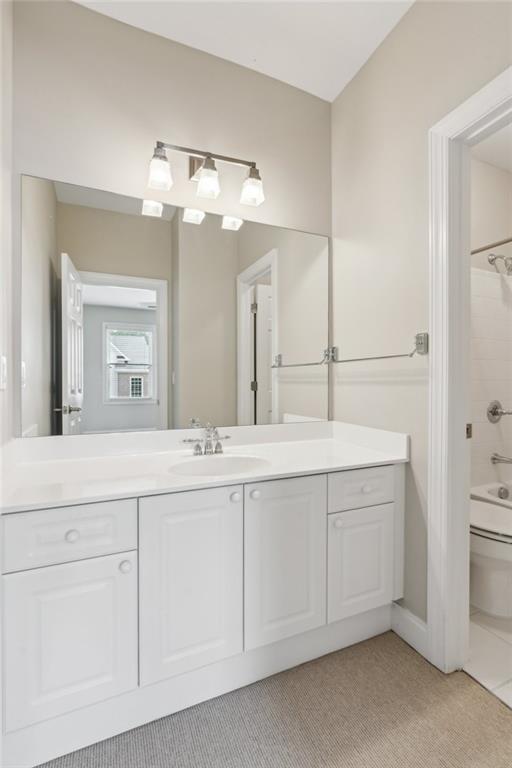 5882 Riverstone Cir Unit 15, Atlanta, GA 30339 - full bathroom with vanity, toilet, and washtub / shower combination