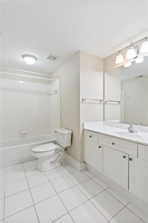 5882 Riverstone Cir Unit 15, Atlanta, GA 30339 - full bathroom with tile patterned flooring, baseboards, vanity, toilet, and tub / shower combination