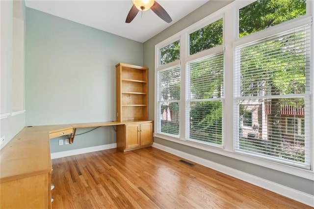 5882 Riverstone Cir Unit 15, Atlanta, GA 30339 - spare room featuring a ceiling fan, baseboards, and light wood-style flooring