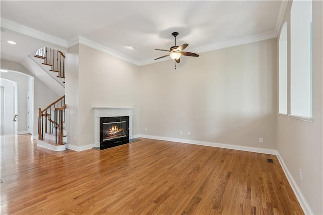 5882 Riverstone Cir Unit 15, Atlanta, GA 30339 - unfurnished living room with stairway, light wood-style floors, a ceiling fan, baseboards, and crown molding