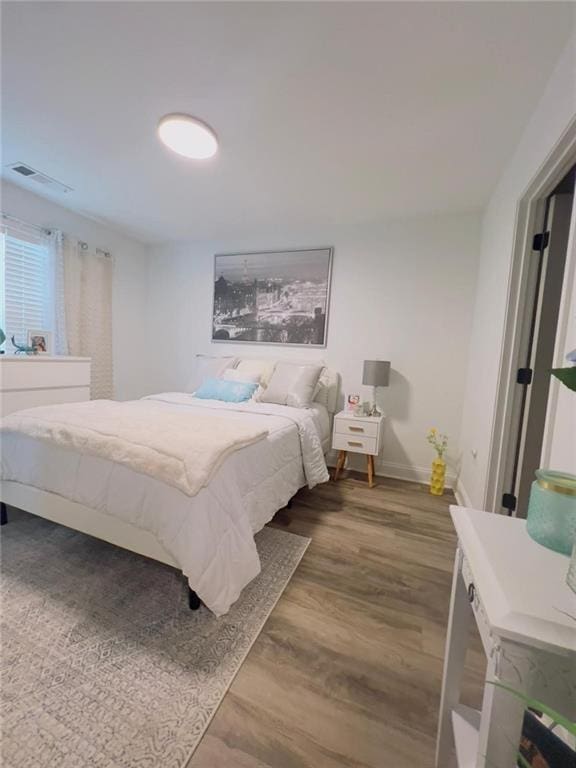 bedroom featuring wood-type flooring