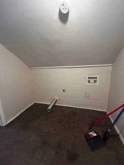 additional living space featuring baseboards and lofted ceiling