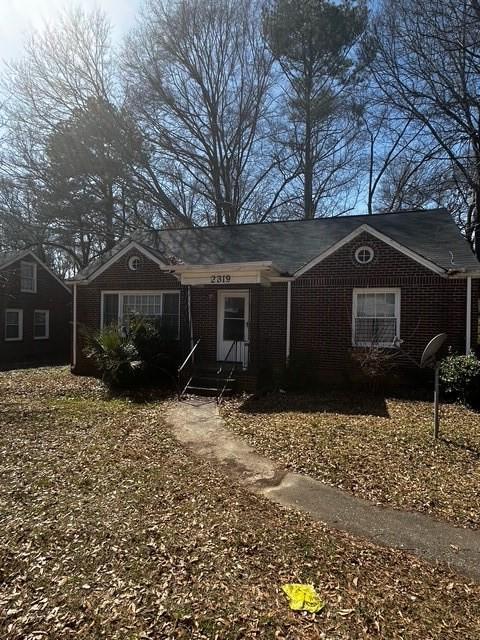 single story home with brick siding