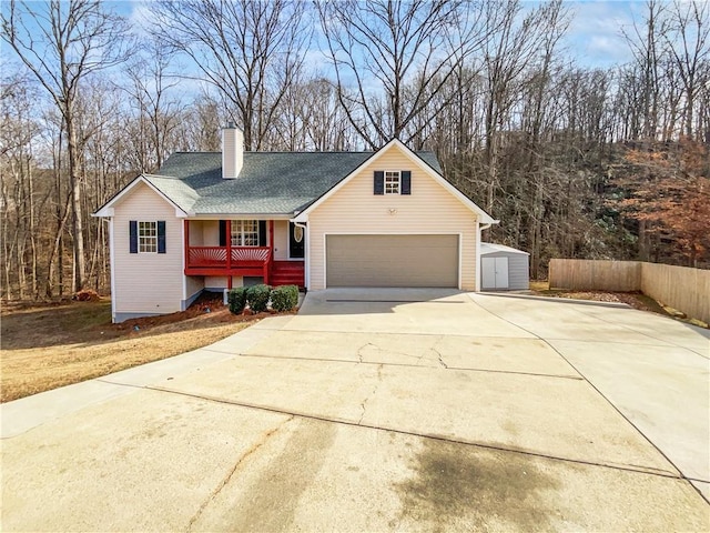 view of front of house with a storage unit and a porch