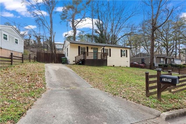 bungalow-style home with a front lawn