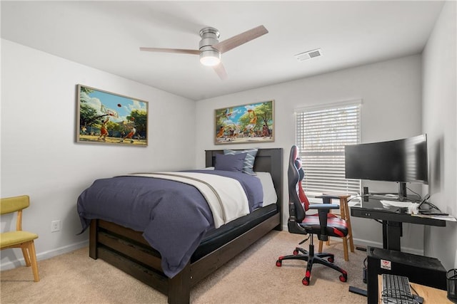 bedroom featuring ceiling fan and light carpet