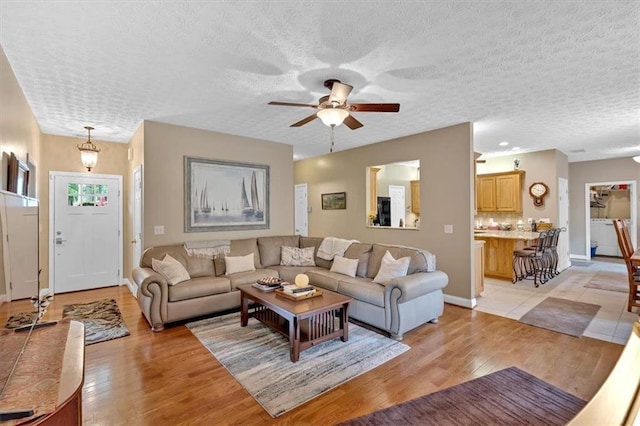 17 Sassafras Trl NE, Cartersville, GA 30121 - living area with light wood-style floors, ceiling fan, and a textured ceiling