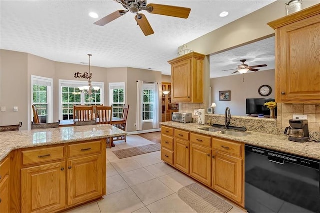 17 Sassafras Trl NE, Cartersville, GA 30121 - kitchen with black dishwasher, a ceiling fan, a textured ceiling, decorative backsplash, and light stone counters