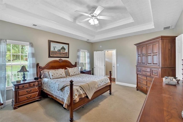 17 Sassafras Trl NE, Cartersville, GA 30121 - bedroom with a raised ceiling, multiple windows, light colored carpet, ornamental molding, and a ceiling fan