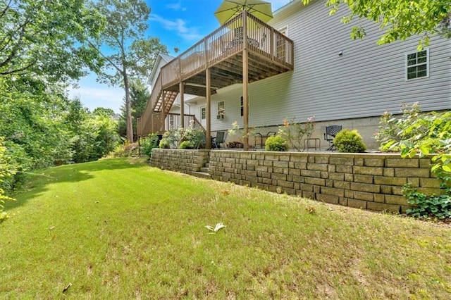 17 Sassafras Trl NE, Cartersville, GA 30121 - back of house featuring a wooden deck, stairs, and a lawn
