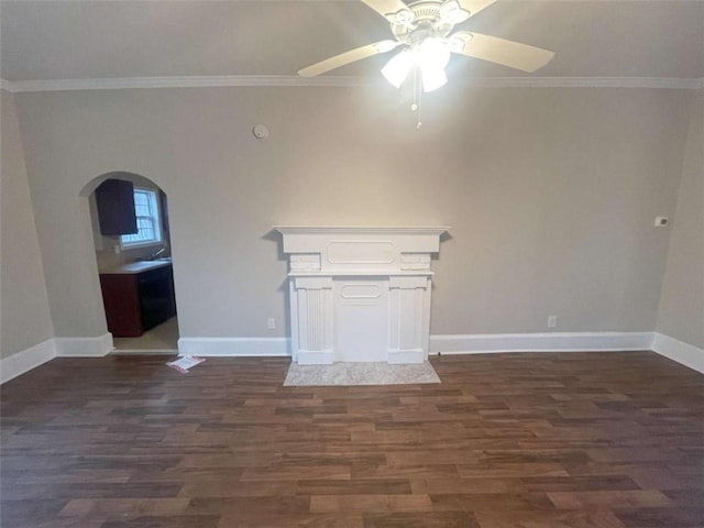 unfurnished living room with crown molding, ceiling fan, and dark hardwood / wood-style floors