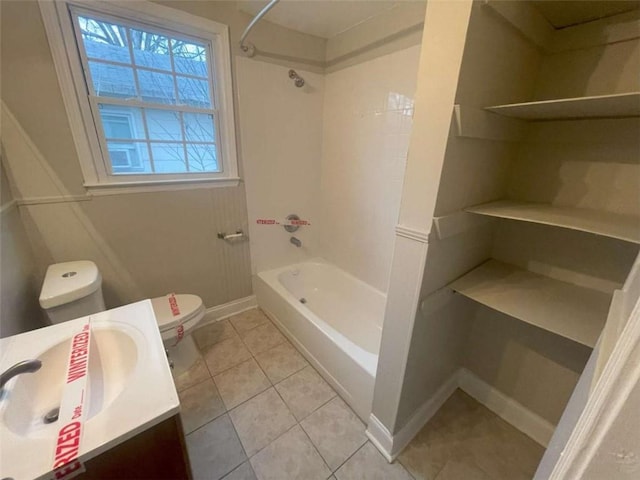 full bathroom with vanity, bathtub / shower combination, tile patterned floors, and toilet