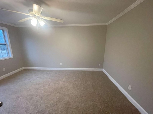 carpeted empty room featuring ornamental molding and ceiling fan