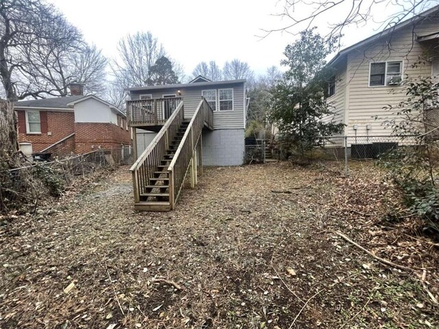 exterior space featuring cooling unit and a deck