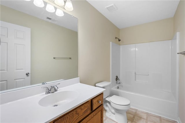 full bathroom featuring vanity, bathtub / shower combination, and toilet