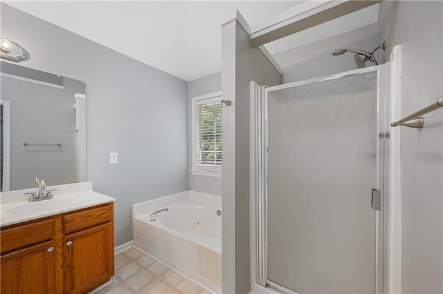 bathroom with vanity and independent shower and bath