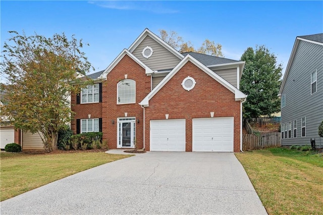 view of property with a garage and a front yard