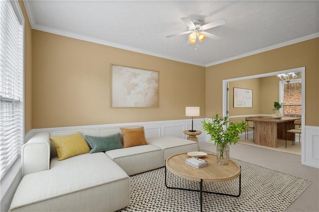 living room featuring ceiling fan and ornamental molding