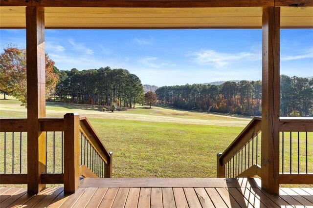 wooden deck with a yard