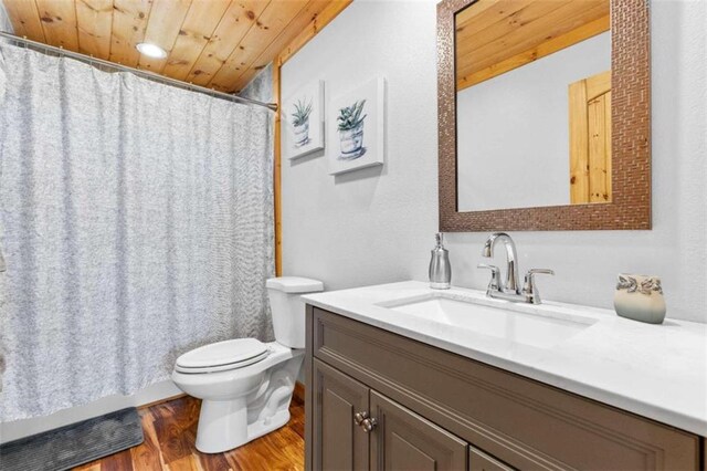 bathroom featuring wood-type flooring, wood ceiling, toilet, a shower with curtain, and vanity