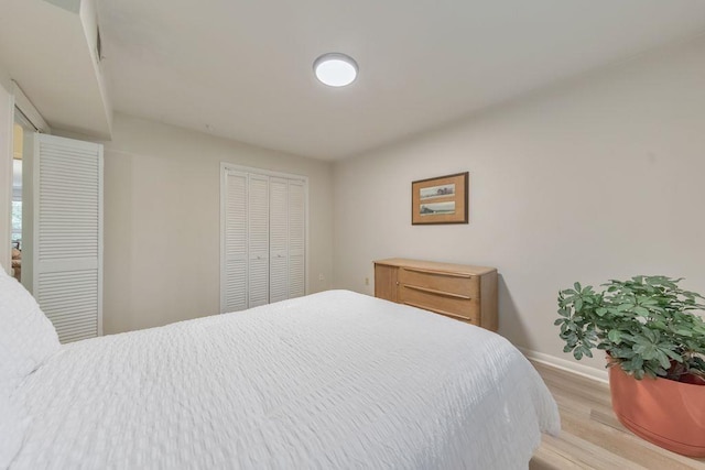 1111 Clairemont Ave Unit N3, Decatur, GA 30030 - bedroom with baseboards, light wood-style flooring, and a closet