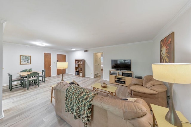 1111 Clairemont Ave Unit N3, Decatur, GA 30030 - living room featuring light wood-style floors, ornamental molding, and baseboards