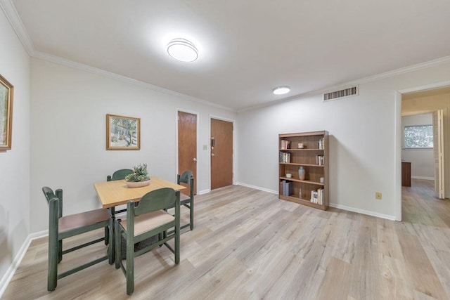1111 Clairemont Ave Unit N3, Decatur, GA 30030 - dining space with light wood finished floors, crown molding, and baseboards