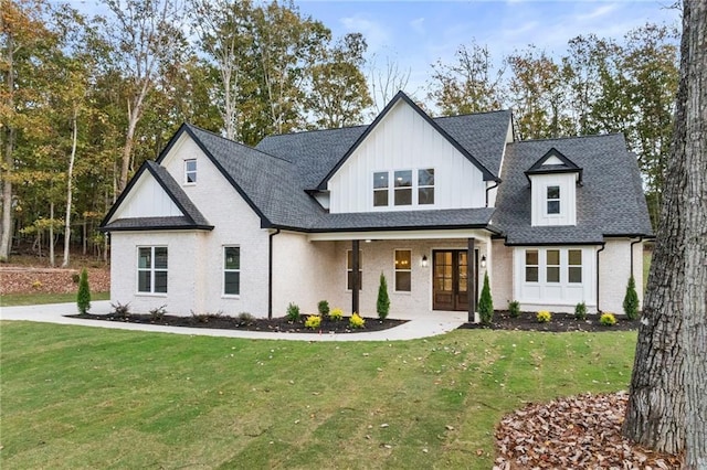 modern inspired farmhouse with a front lawn